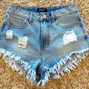Frayed and distressed jean shorts